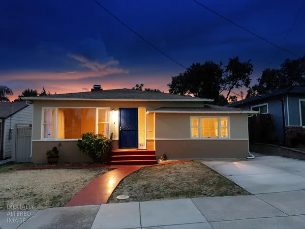 front view of a house with a yard