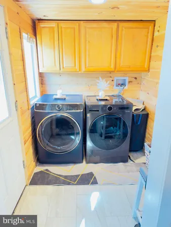 a kitchen with a sink a stove and two cabinets
