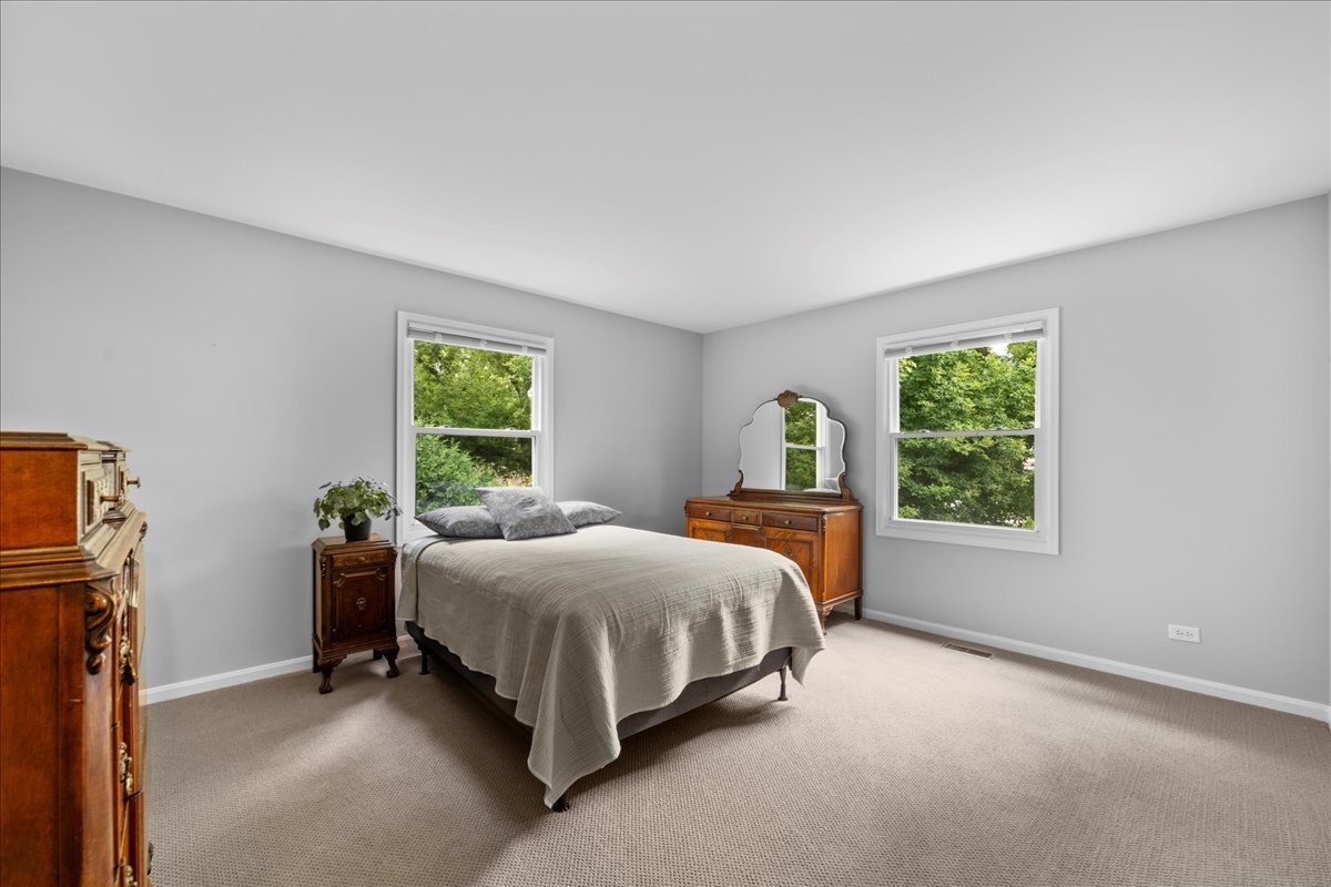 1554 Deer Run Road Gurnee, IL 60031 - Photo 12 of 24 a bedroom with a bed and a window
