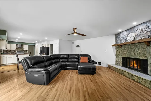 a living room with furniture and a fireplace