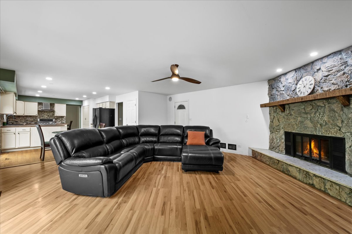 1554 Deer Run Road Gurnee, IL 60031 - Photo 8 of 24 a living room with furniture and a fireplace