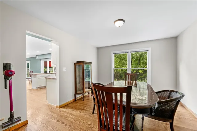 a dining room with furniture and window