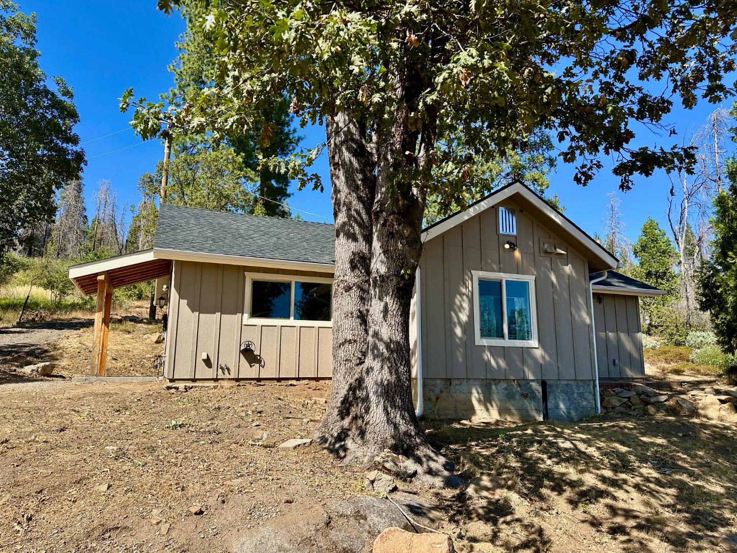 38295 Cressman Road Shaver Lake, CA 93664 - Photo 11 of 31 a front view of a house with a yard