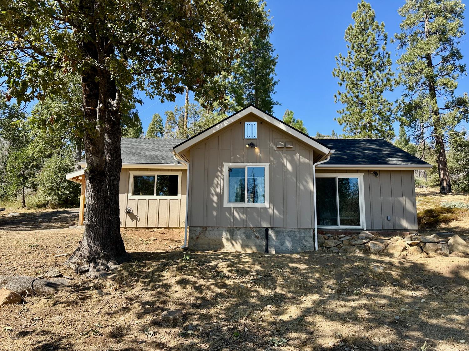 38295 Cressman Road Shaver Lake, CA 93664 - Photo 12 of 31 a front view of a house with a yard