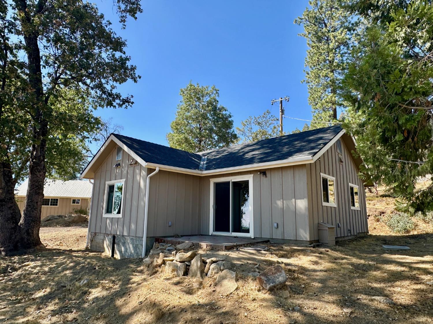 38295 Cressman Road Shaver Lake, CA 93664 - Photo 14 of 31 a view of a house with a tree in front