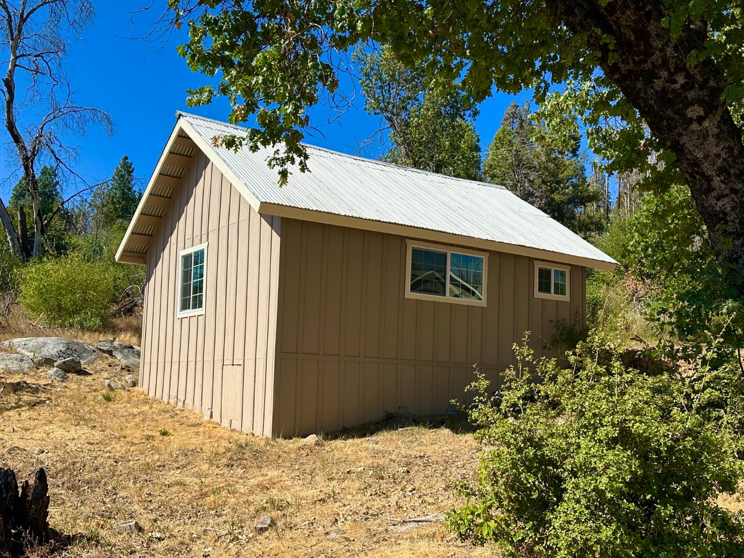 38295 Cressman Road Shaver Lake, CA 93664 - Photo 17 of 31 a view of a house with a yard