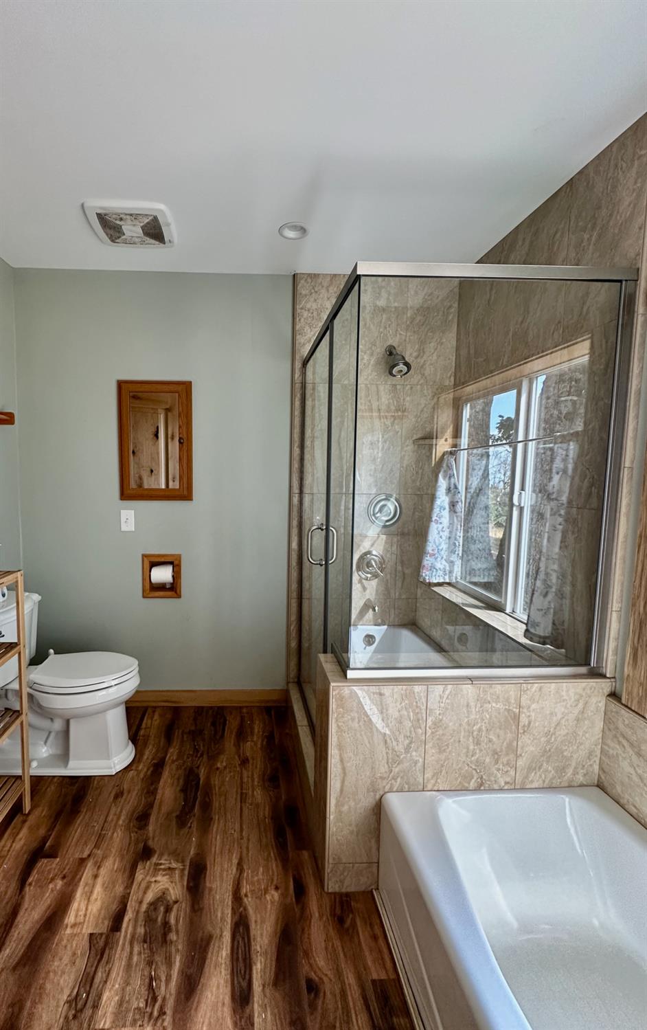 38295 Cressman Road Shaver Lake, CA 93664 - Photo 19 of 31 a bathroom with a bathtub and a sink