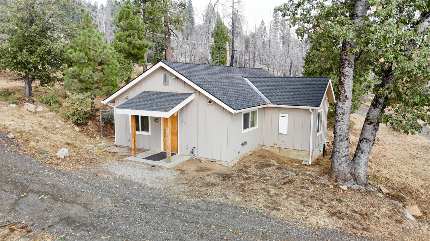 38295 Cressman Road Shaver Lake, CA 93664 - Photo 23 of 31 a view of a house with a yard