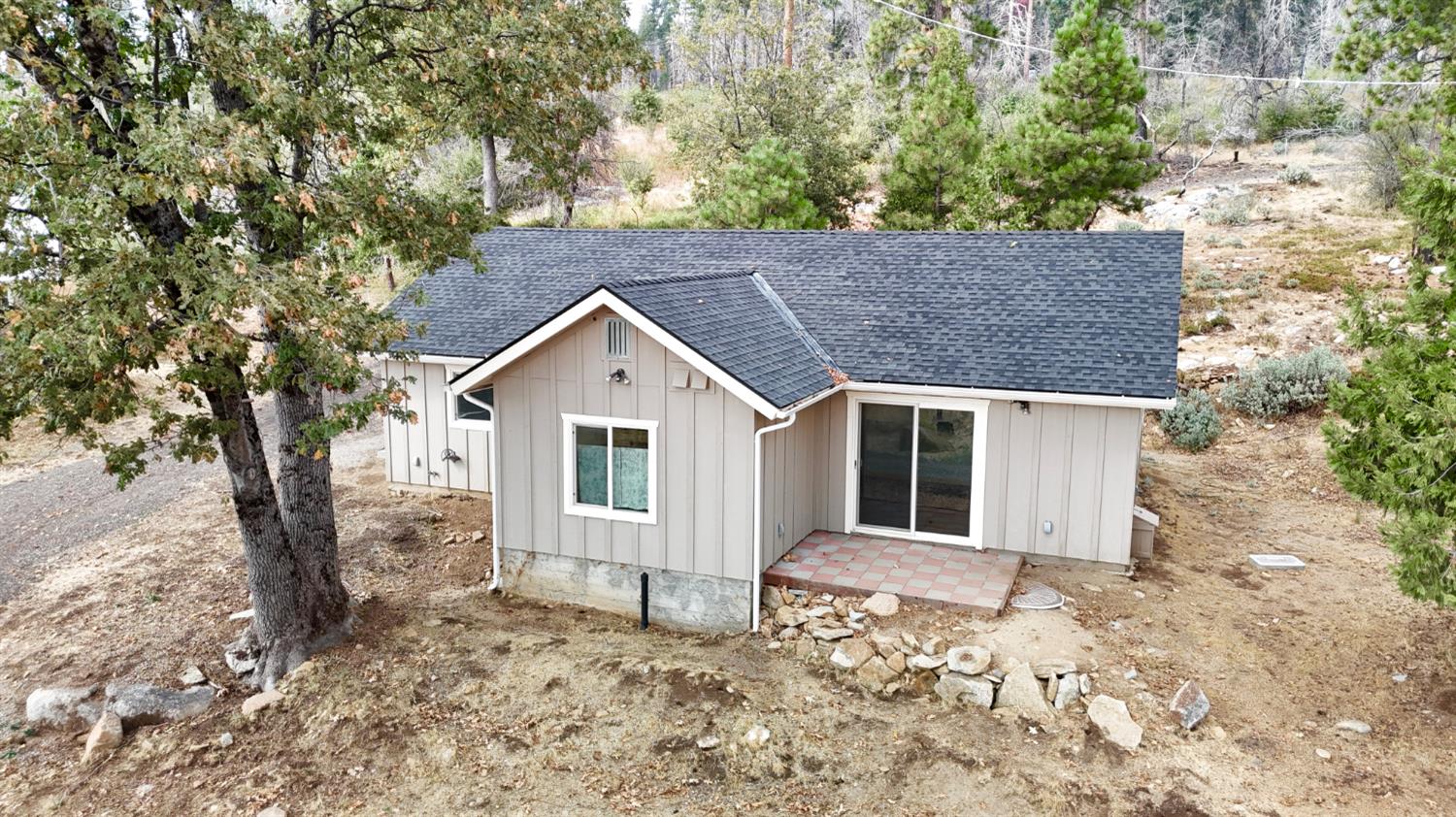 38295 Cressman Road Shaver Lake, CA 93664 - Photo 24 of 31 front view of a house with a yard