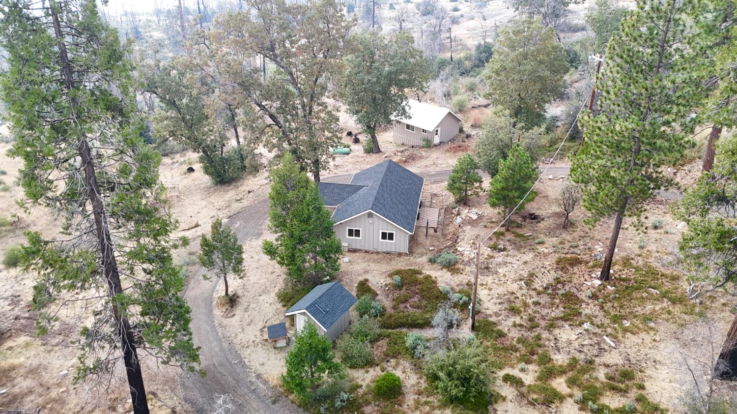 38295 Cressman Road Shaver Lake, CA 93664 - Photo 26 of 31 an aerial view of a house with a yard