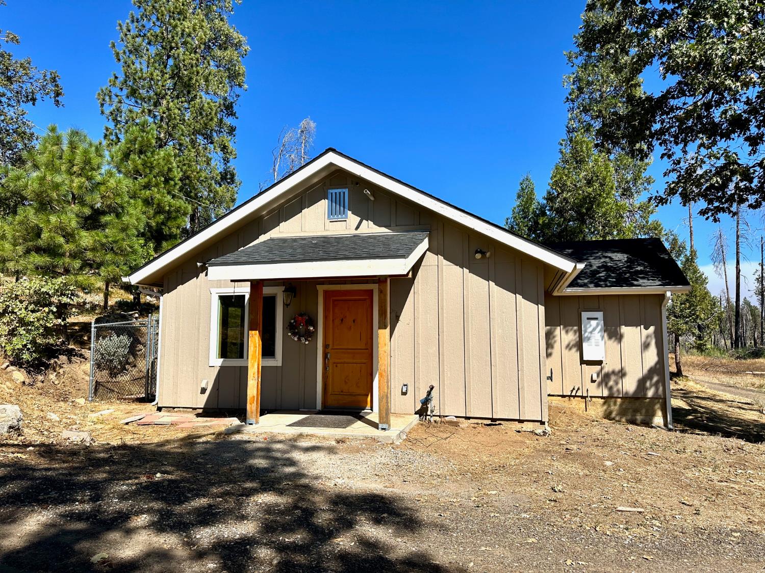 38295 Cressman Road Shaver Lake, CA 93664 - Photo 10 of 31 a front view of a house with a yard