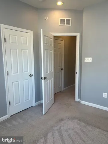 a view of front door of house with stairs