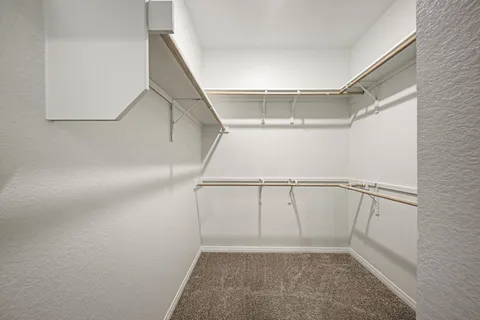 a view of an empty walk in closet