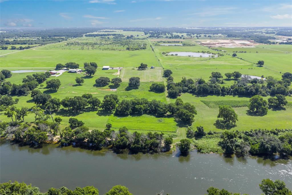 101 Private Road Aquilla, TX 76622 - Photo 5 of 19 Overview of rural landscape with a nearby body of water