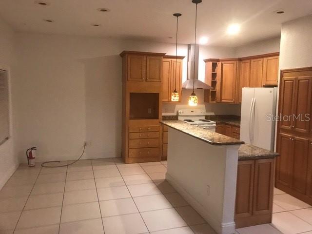 1911 May Street Brandon, FL 33510 - Photo 4 of 9 a kitchen with stainless steel appliances a refrigerator sink and microwave