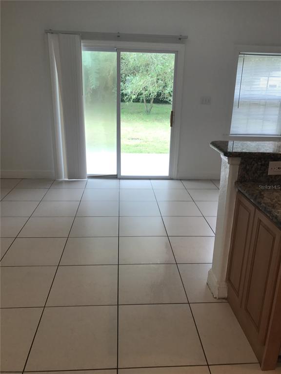 1911 May Street Brandon, FL 33510 - Photo 7 of 9 a view of an empty room with a window
