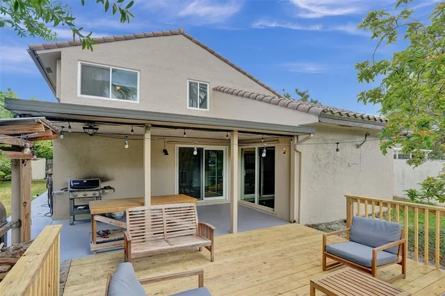 a view of living room kitchen with furniture and outdoor seating