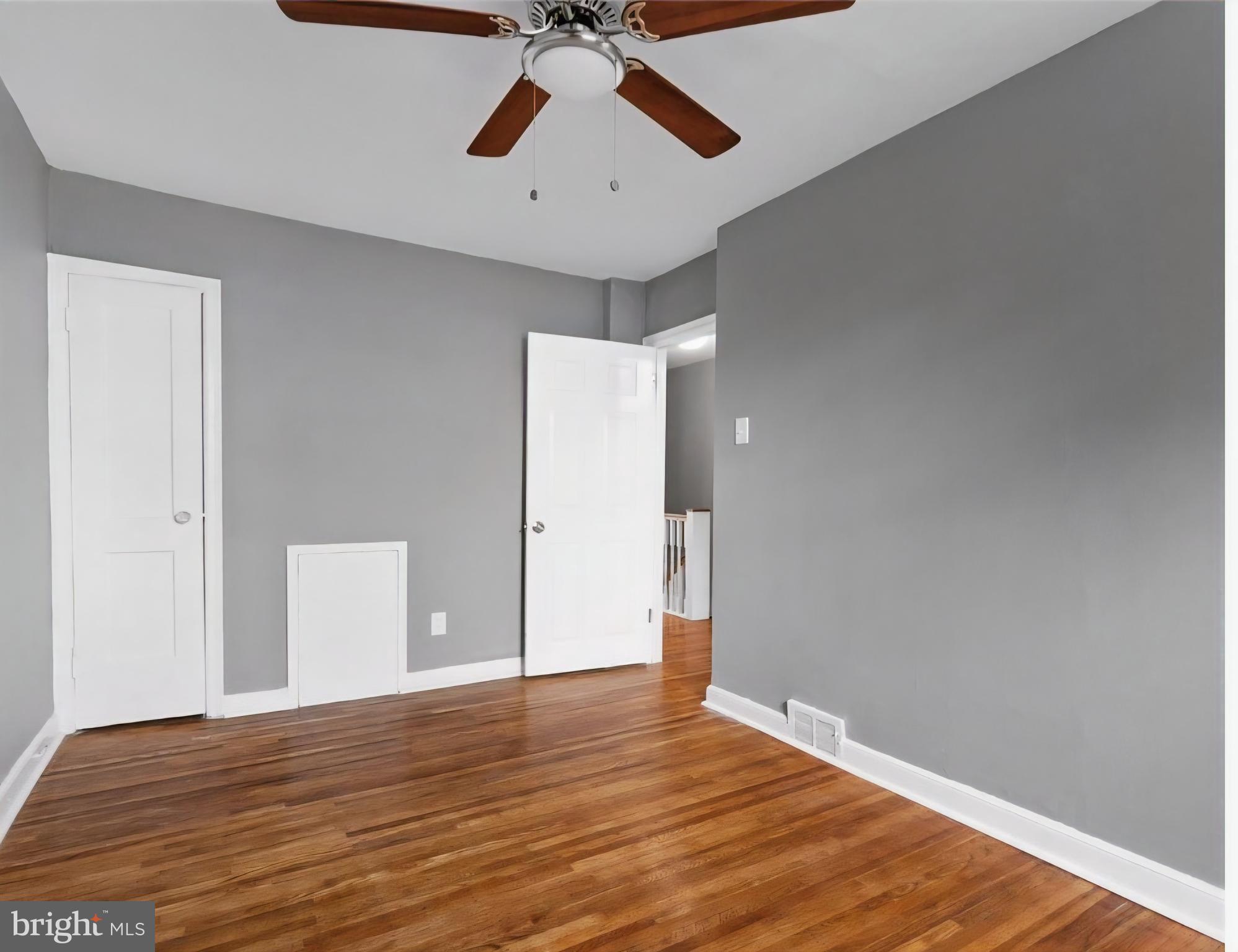 8332 Forrest Avenue Philadelphia, PA 19150 - Photo 12 of 19 a view of an empty room with wooden floor