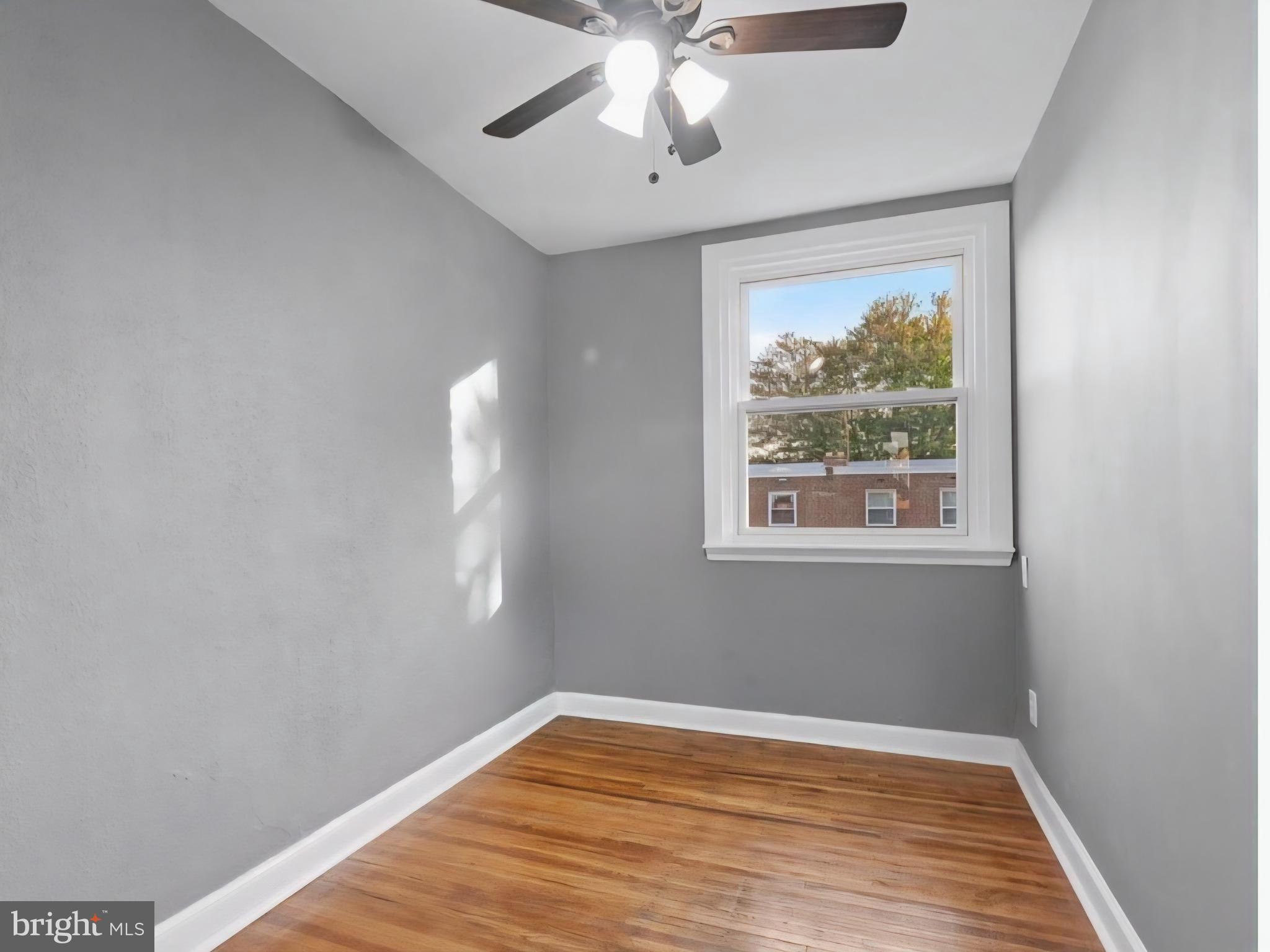 8332 Forrest Avenue Philadelphia, PA 19150 - Photo 13 of 19 a view of empty room with window and wooden floor