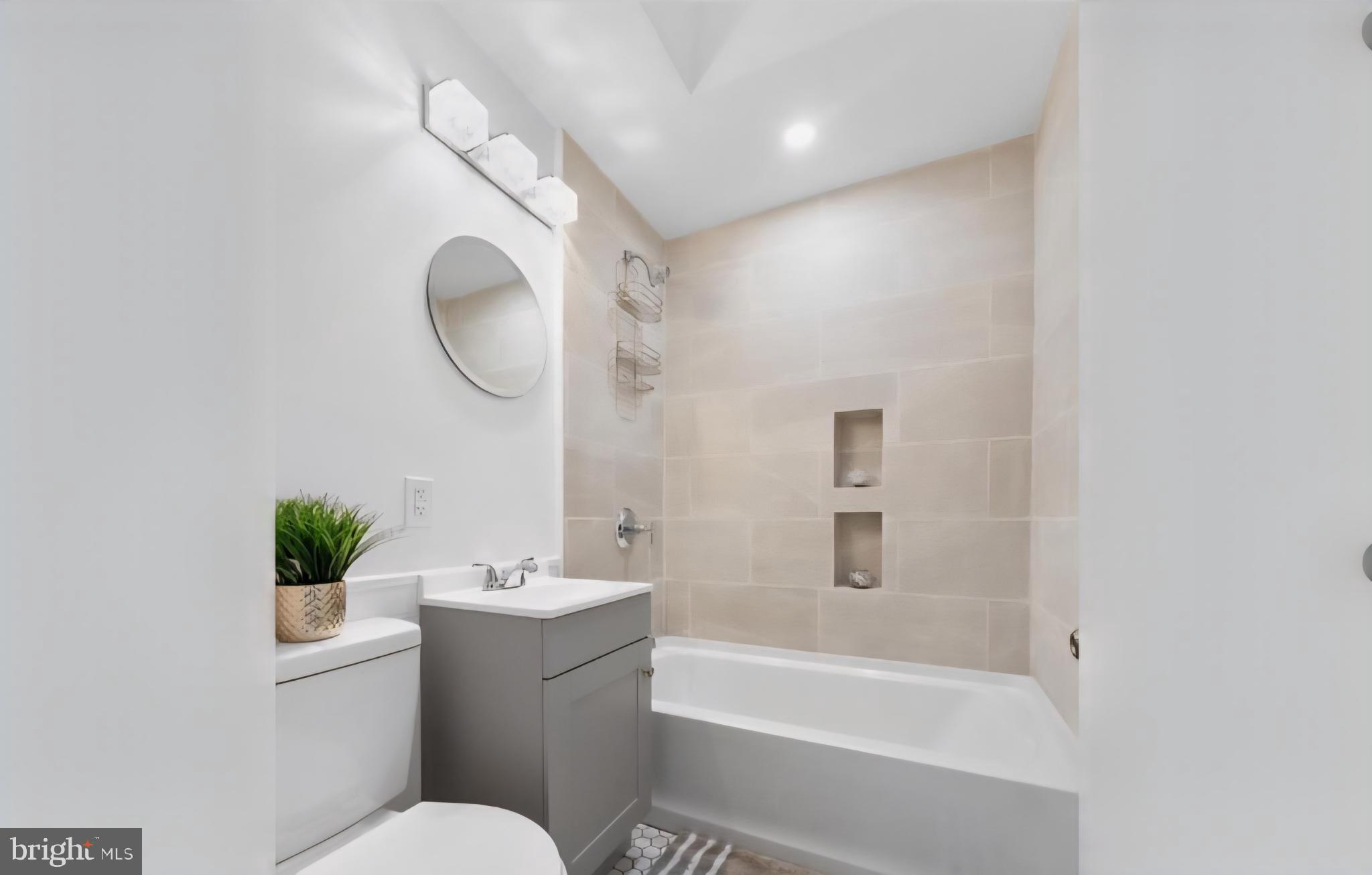 8332 Forrest Avenue Philadelphia, PA 19150 - Photo 15 of 19 a bathroom with a toilet sink and bathtub