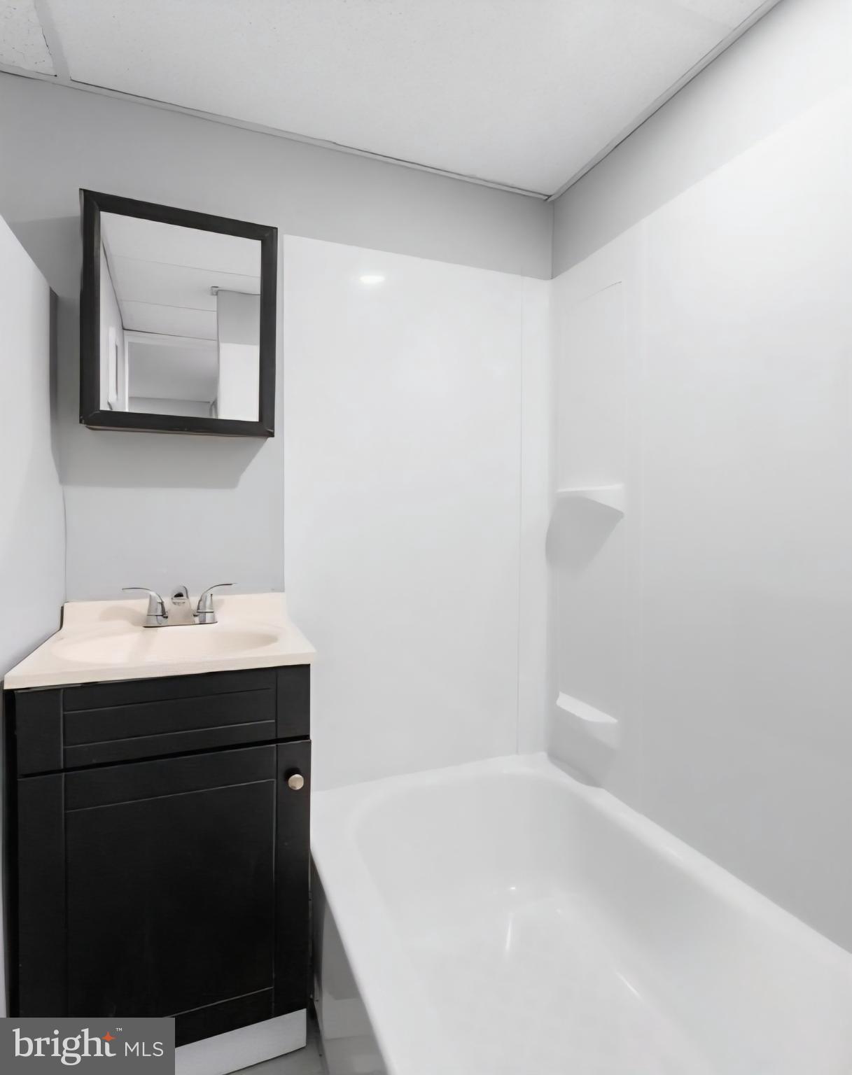 8332 Forrest Avenue Philadelphia, PA 19150 - Photo 17 of 19 a bathroom with a sink and a bathtub