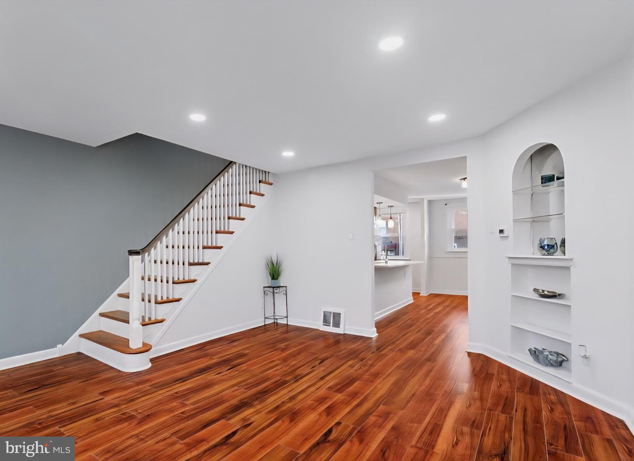 8332 Forrest Avenue Philadelphia, PA 19150 - Photo 3 of 19 a view of a bedroom with wooden floor and stairs