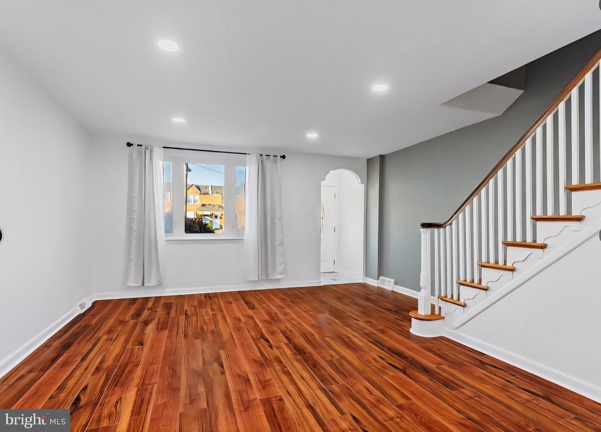 8332 Forrest Avenue Philadelphia, PA 19150 - Photo 4 of 19 a view of a big room with wooden floor and staircase