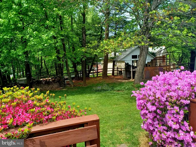a bedroom with furniture and a flat screen tv