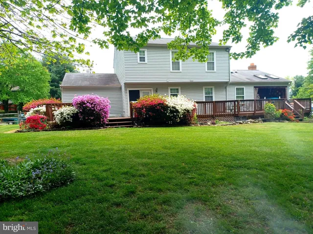 a living room with furniture a rug and a fireplace