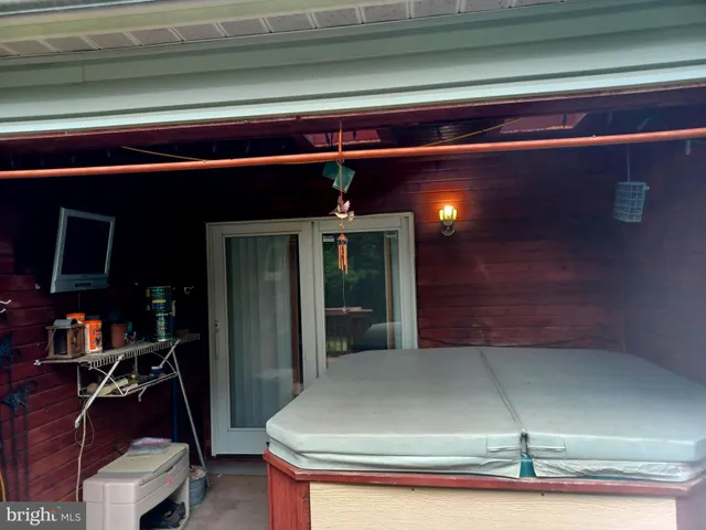 a bedroom with a bed and a lamp on table