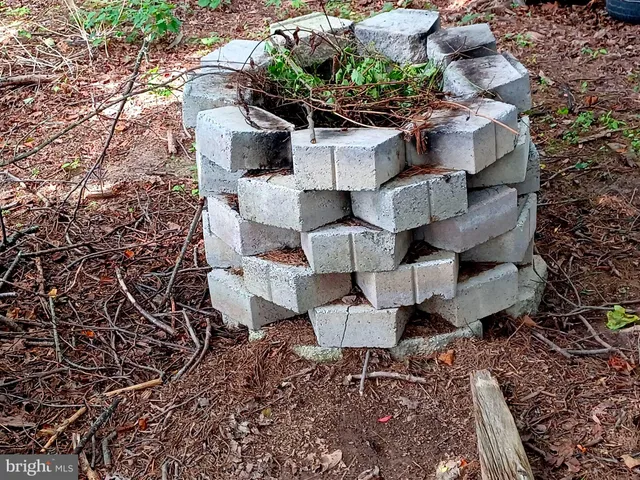 a bedroom with a bed and a flat tv screen on a dresser