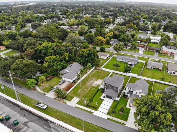 an aerial view of a residential houses with outdoor space
