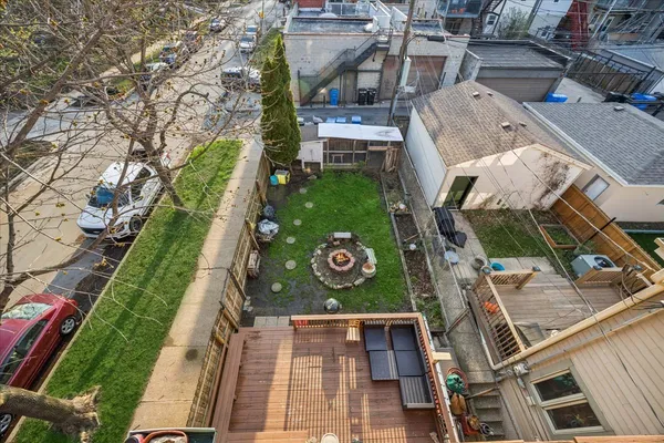 a view of balcony with wooden floor and outdoor seating