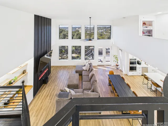 a view of living room with furniture and fireplace