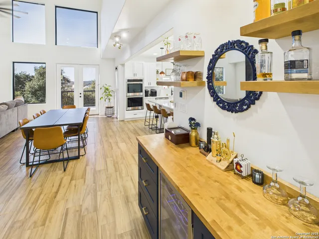 a spacious bathroom with a sink and a mirror
