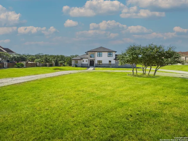 a view of an ocean with a house in the background