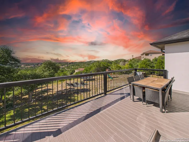 a view of a terrace with wooden floor and city view