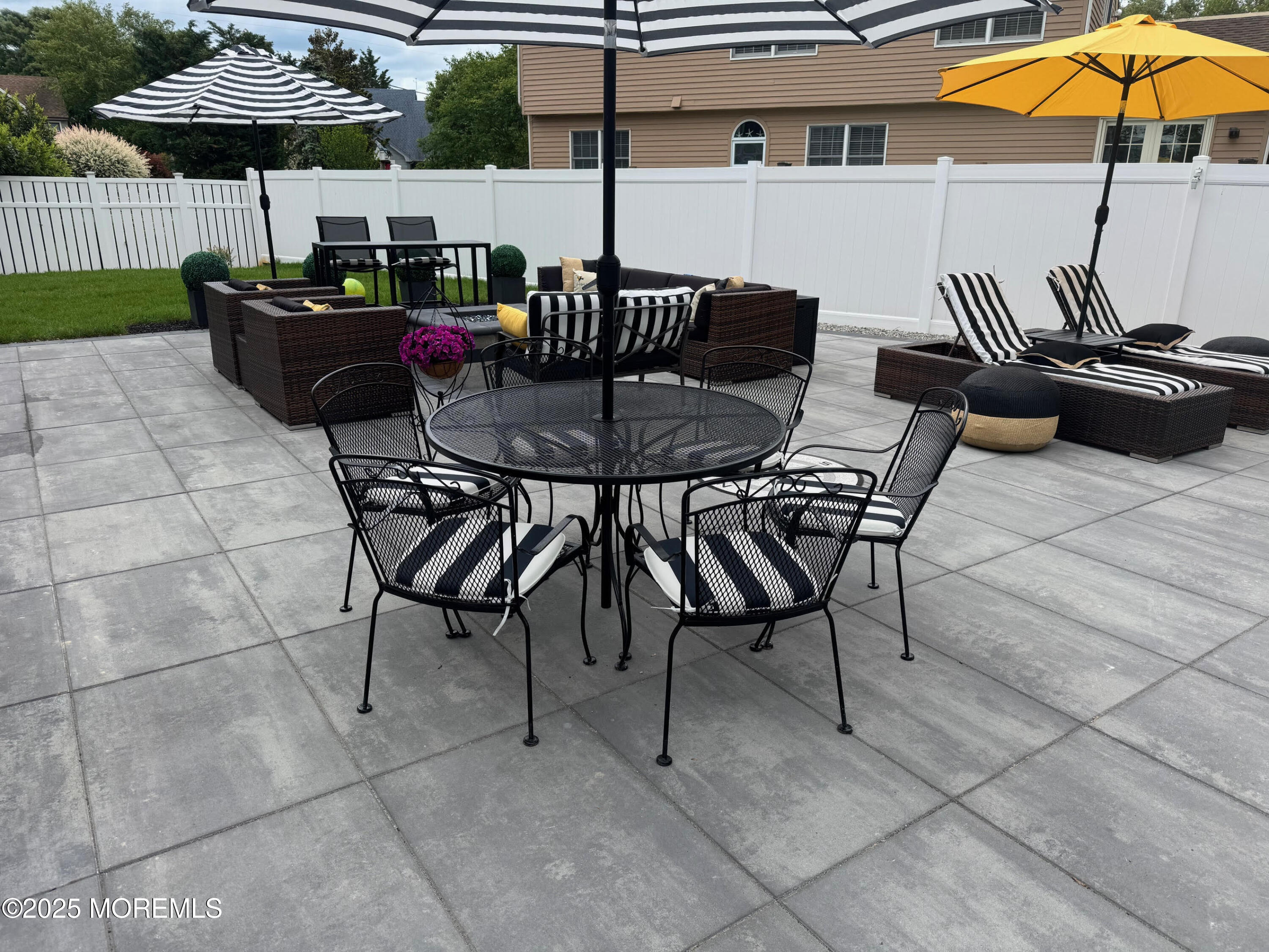 141 Osborn Avenue Bay Head, NJ 08742 - Photo 11 of 48 a view of a roof deck with table and chairs under an umbrella