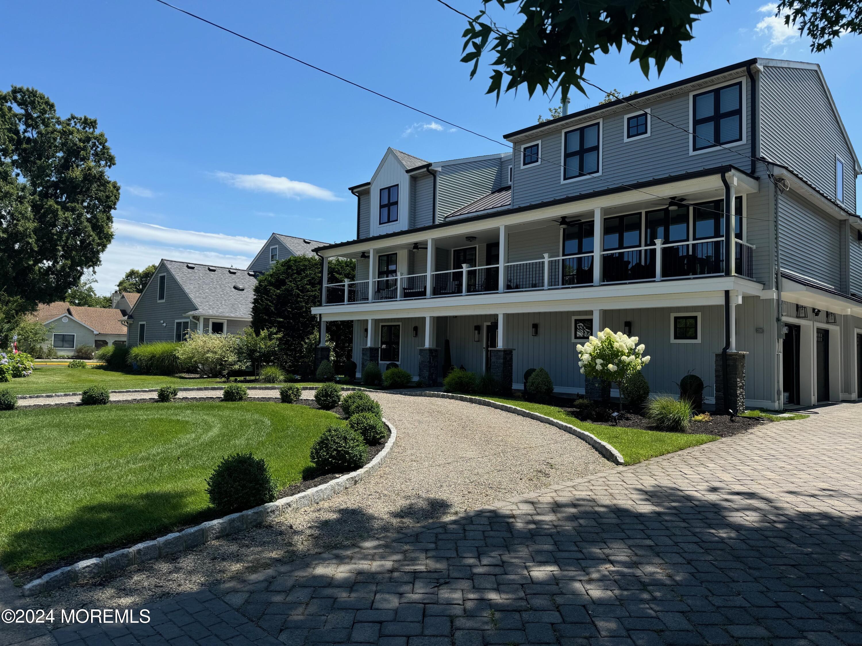 141 Osborn Avenue Bay Head, NJ 08742 - Photo 13 of 48 a front view of a house with a yard and potted plants