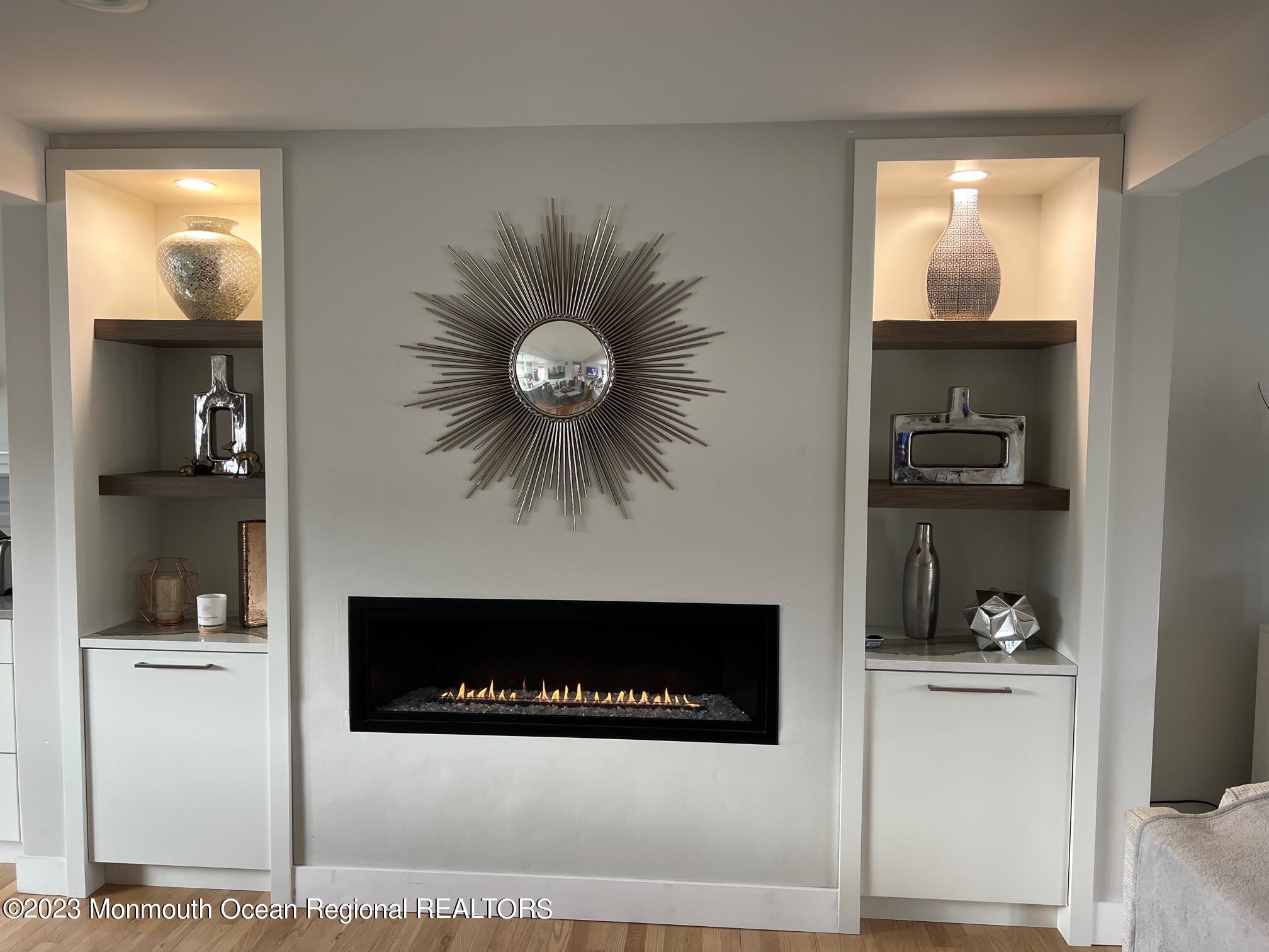 141 Osborn Avenue Bay Head, NJ 08742 - Photo 16 of 48 a view of a livingroom with a fireplace and a chandelier fan