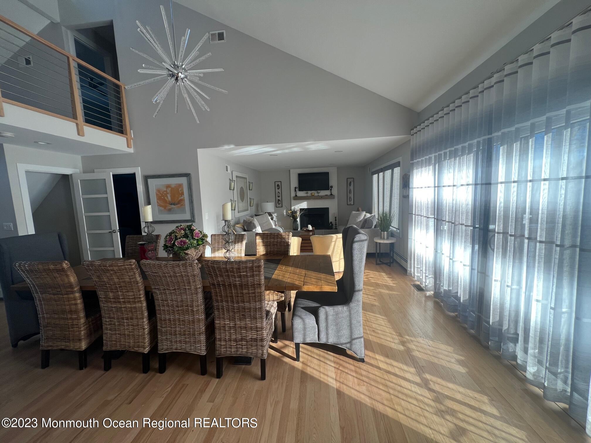 141 Osborn Avenue Bay Head, NJ 08742 - Photo 23 of 48 a living room with couches a large mirror with wooden floor
