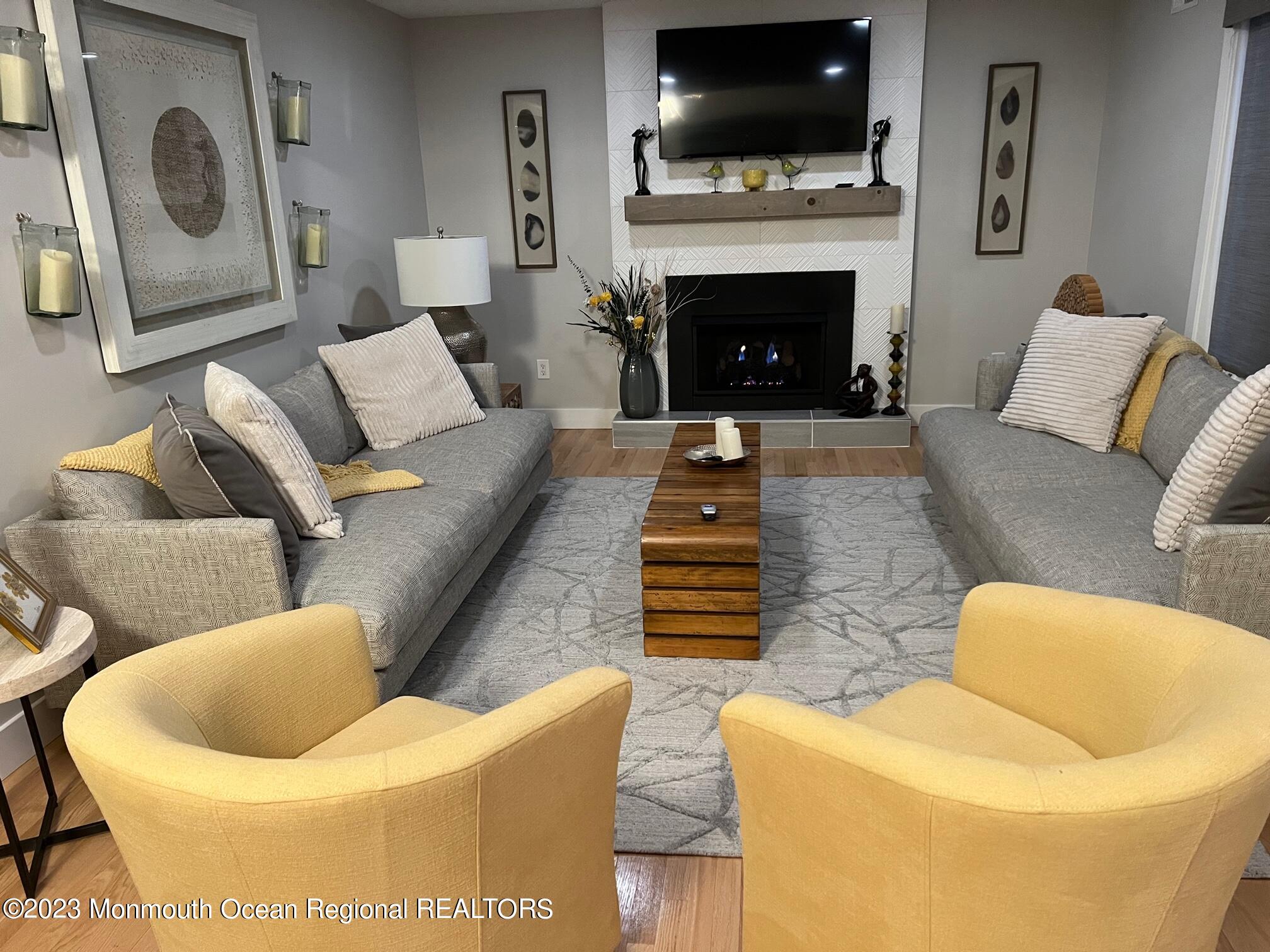 141 Osborn Avenue Bay Head, NJ 08742 - Photo 26 of 48 a living room with furniture and a fireplace