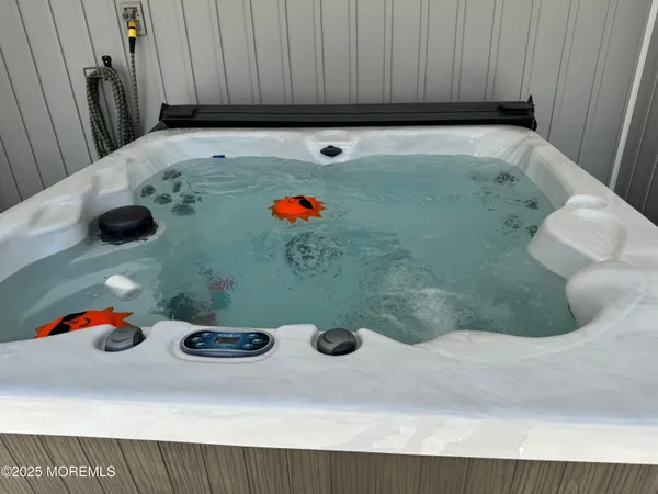 a swimming pool with outdoor seating