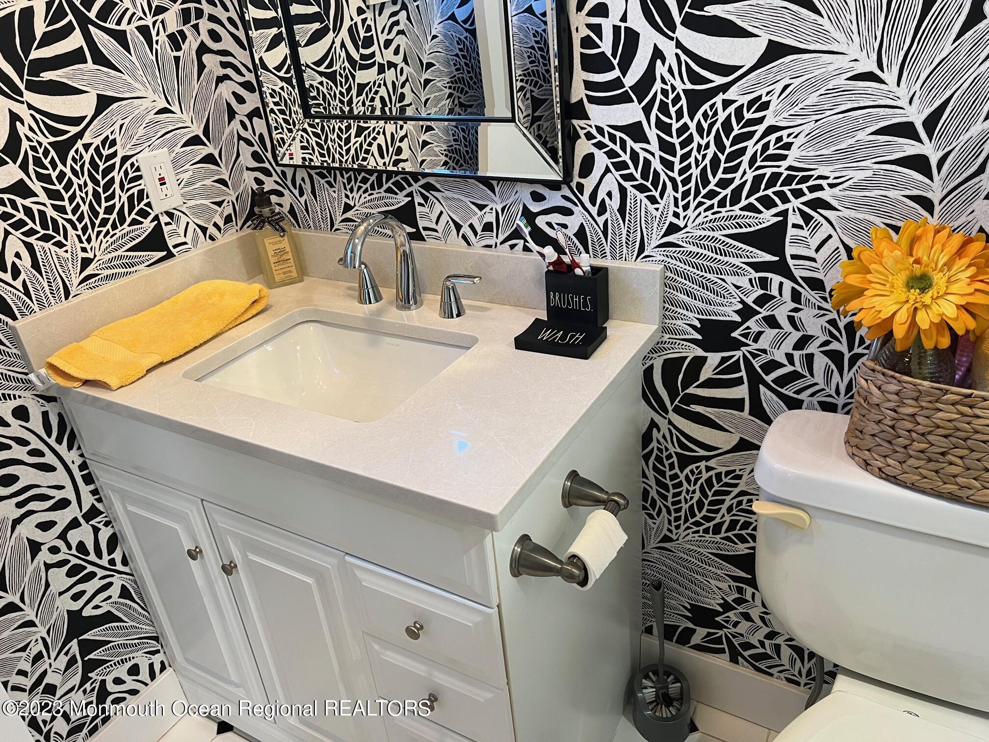 141 Osborn Avenue Bay Head, NJ 08742 - Photo 34 of 48 a bathroom with a sink toilet and mirror