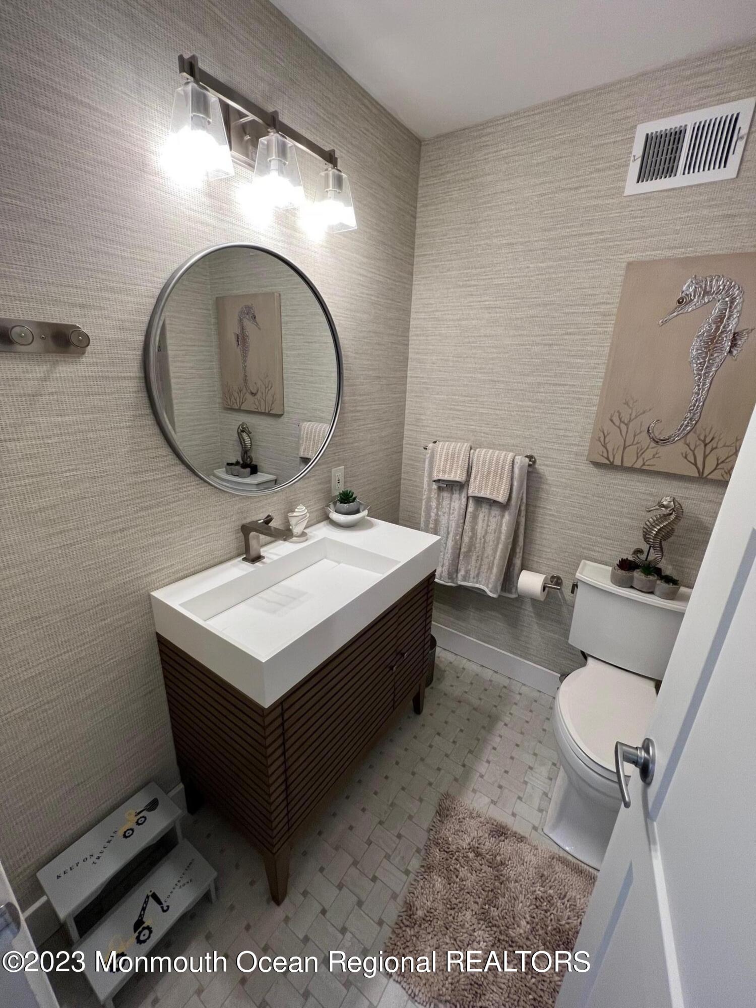 141 Osborn Avenue Bay Head, NJ 08742 - Photo 36 of 48 a bathroom with a sink mirror and toilet