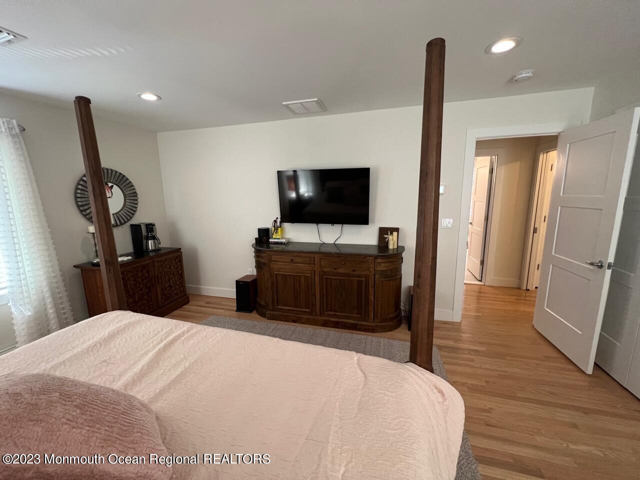 141 Osborn Avenue Bay Head, NJ 08742 - Photo 39 of 48 a bedroom with a bed and a flat screen tv