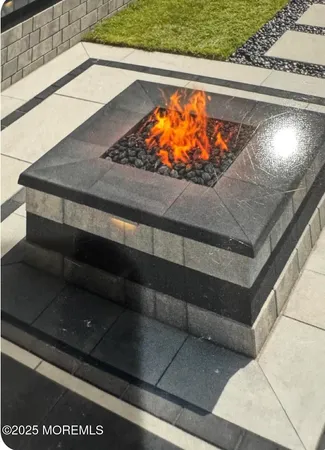 a view of a roof deck with furniture