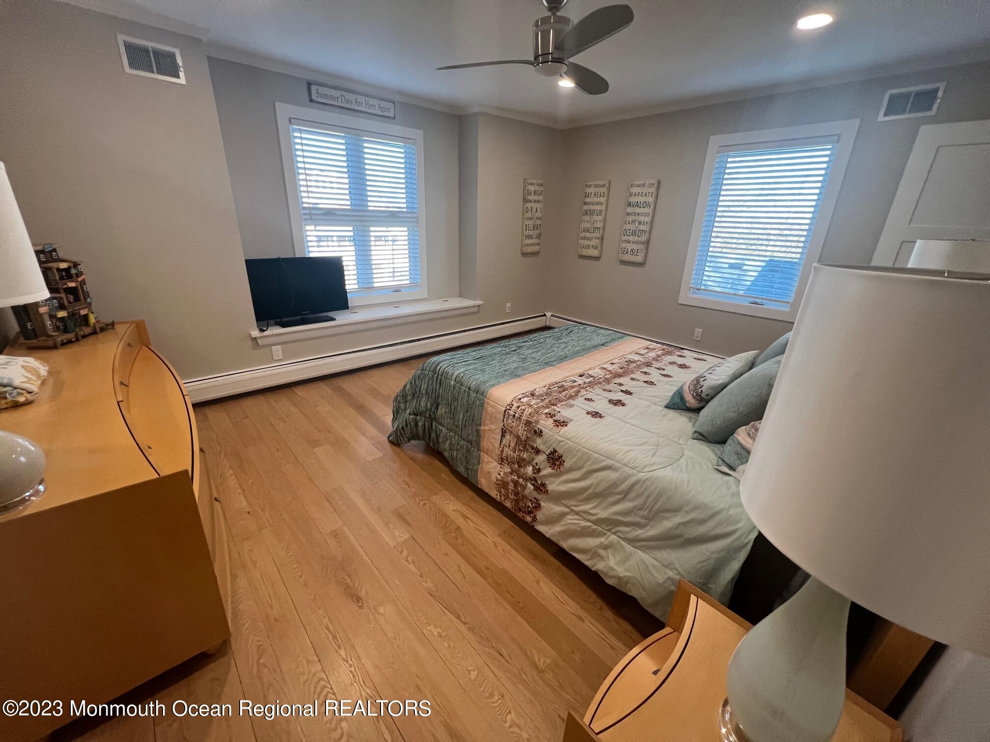 141 Osborn Avenue Bay Head, NJ 08742 - Photo 42 of 48 a bedroom with a bed and wooden floor