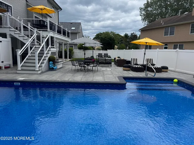 a stove top oven sitting inside of a kitchen