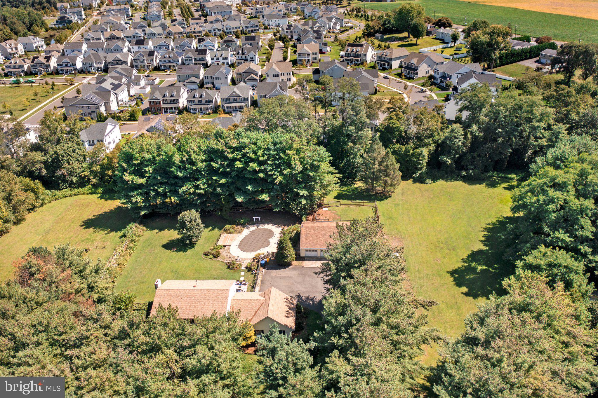 87 Bordentown Chesterfield Road Chesterfield, NJ 08515 - Photo 30 of 49 an aerial view of residential houses with outdoor space and swimming pool